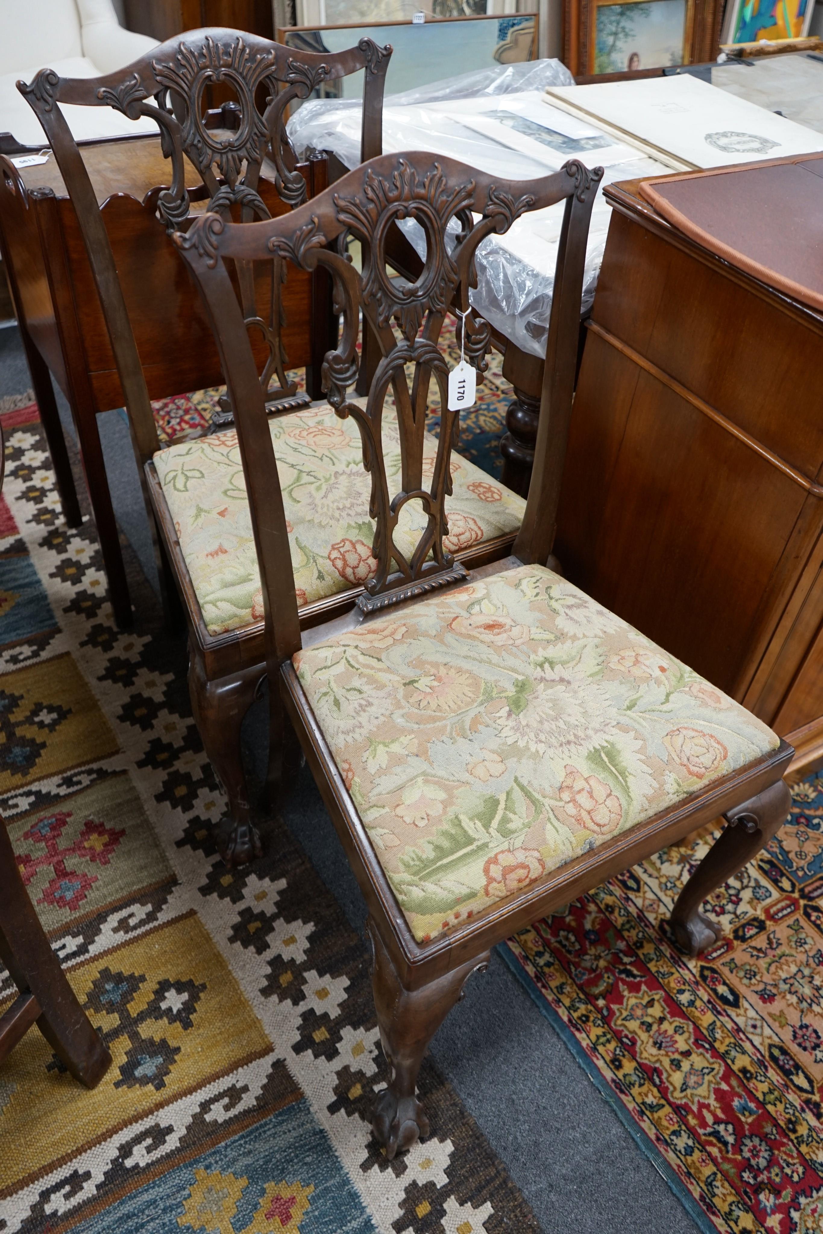 A pair of George III style mahogany dining chairs